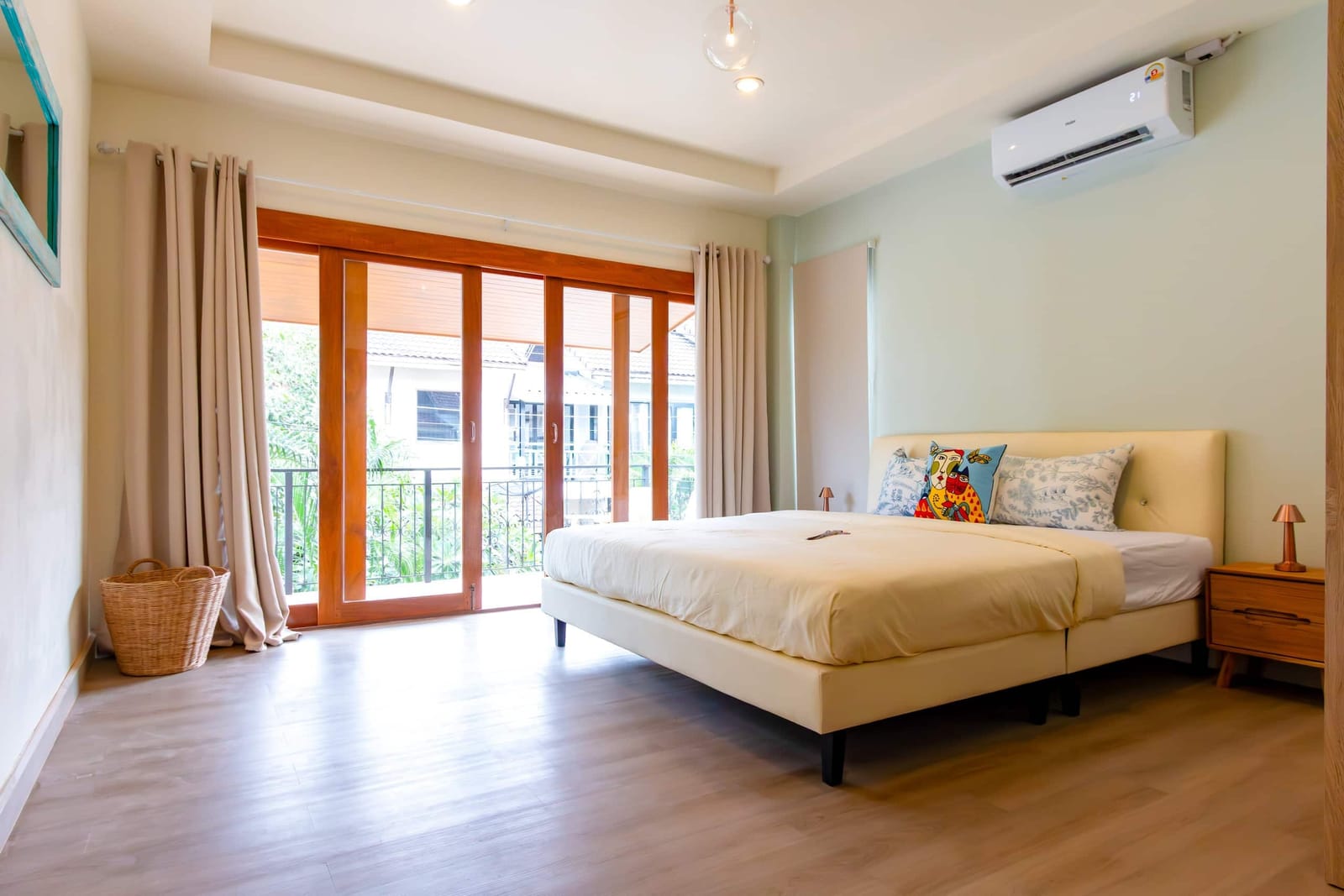 Main bedroom opening onto a balcony at Haven House