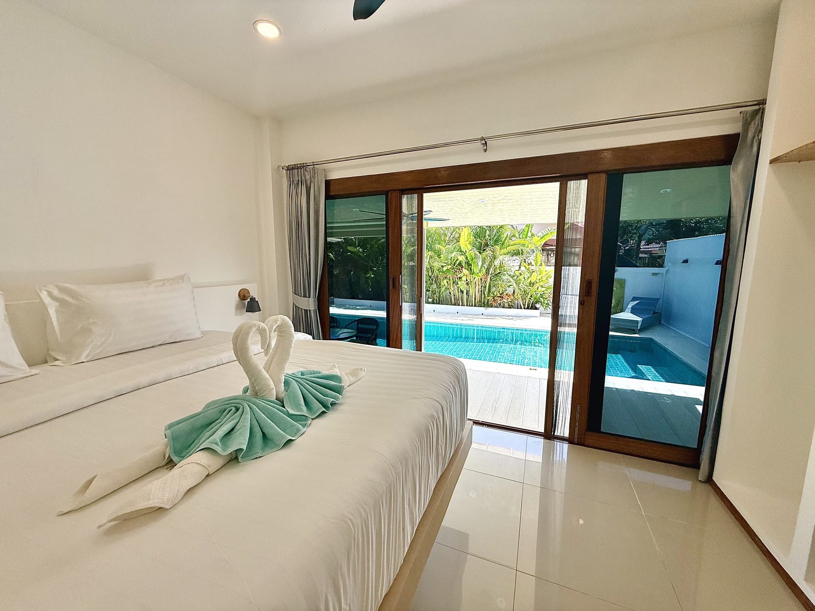 King bedroom with direct pool access at Villa Bua