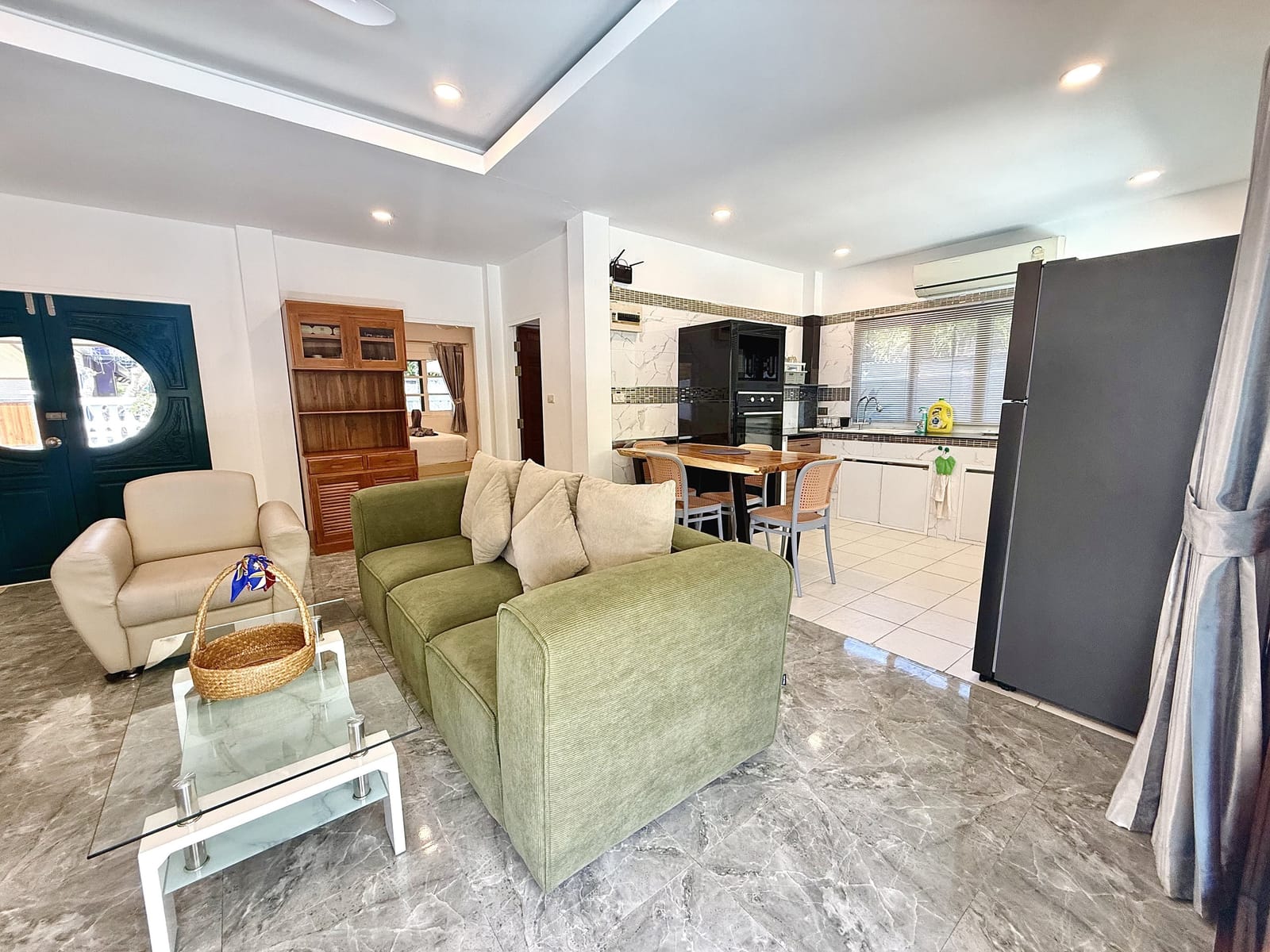 Villa Bua living room opening onto the pool