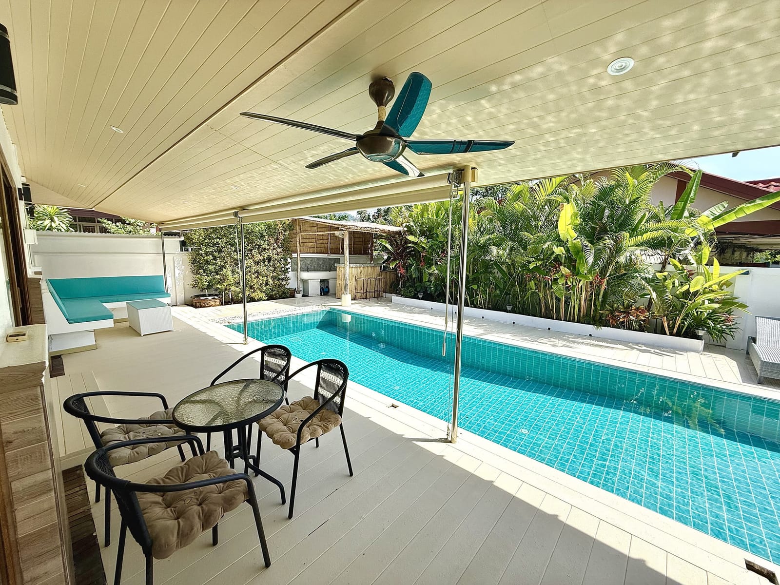 Pool terrace with sun loungers at Villa Bua