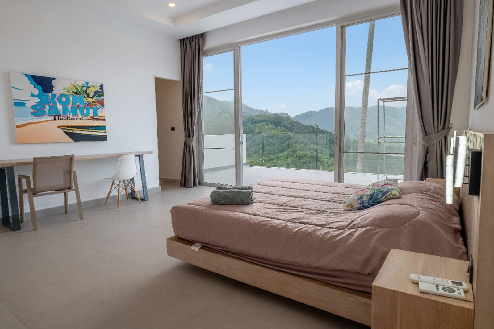 Bright bedroom with a private TV at Villa Passiflore
