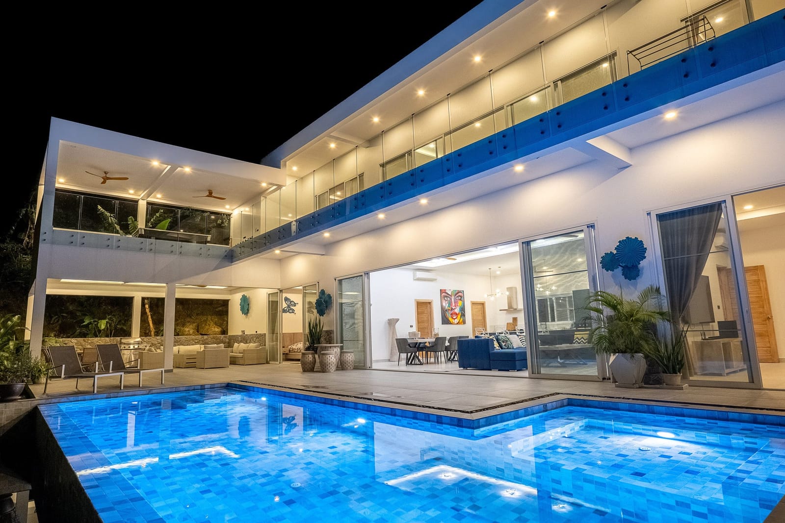 Villa Passiflore pool lit up at night