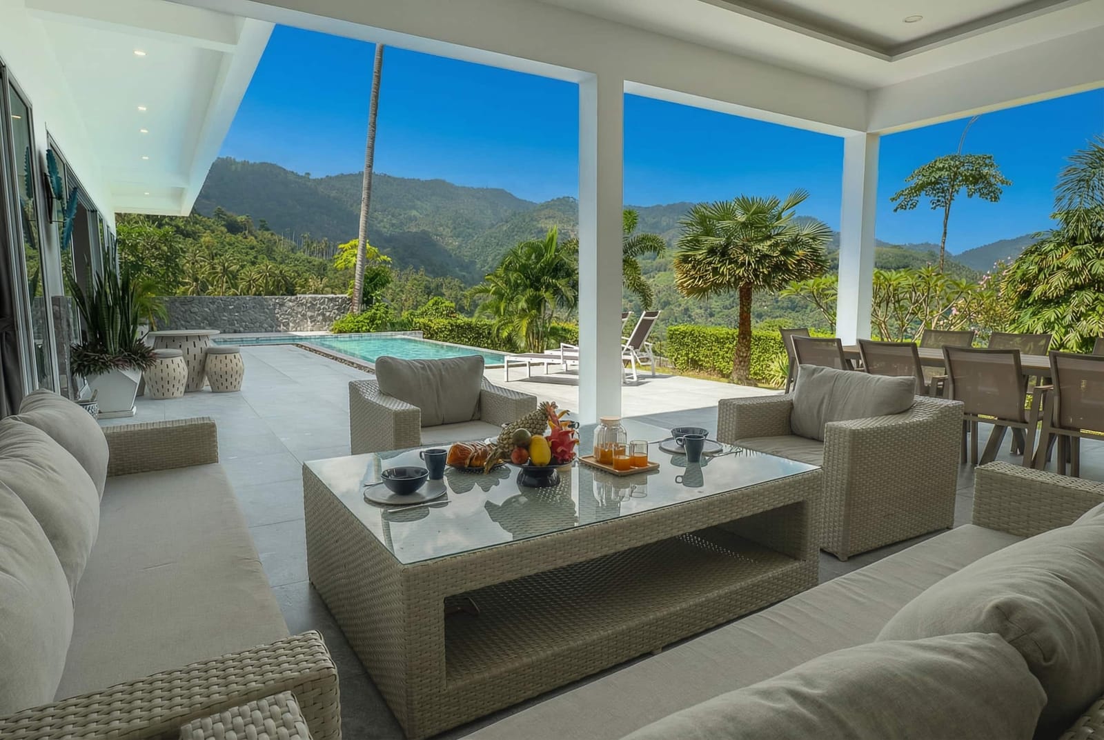 Covered outdoor lounge overlooking the pool at Villa Passiflore