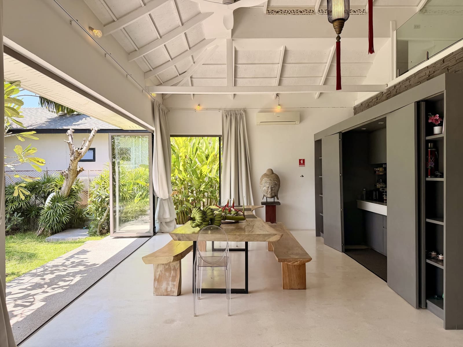 Dining area opening onto the garden at Villa Samui Cao