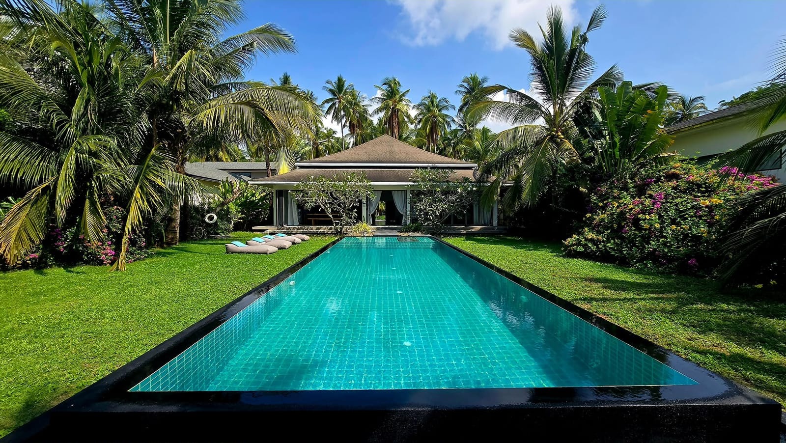Long private pool in the tropical garden at Villa Samui Cao